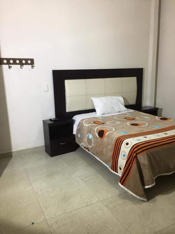 Postel nebo postele na pokoji v ubytování Hotel Coatlicue