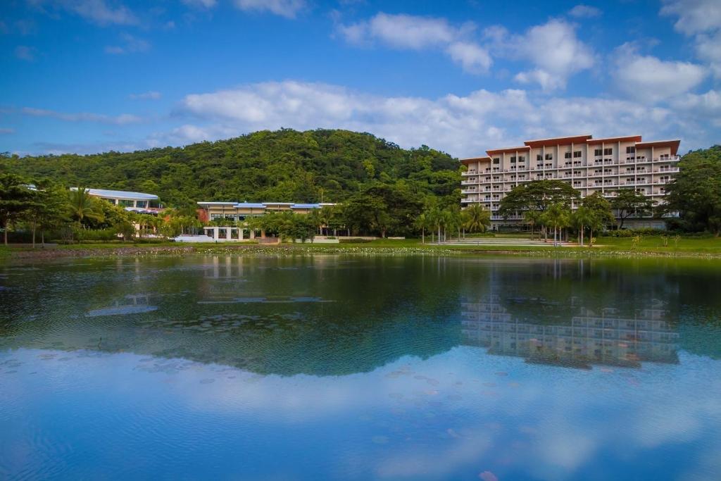 a large body of water in front of a building at Pico Sands Hotel in Nasugbu