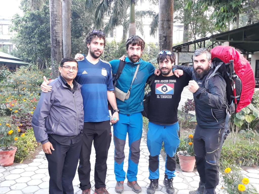 a group of men posing for a picture at Sauraha Resort in Sauraha