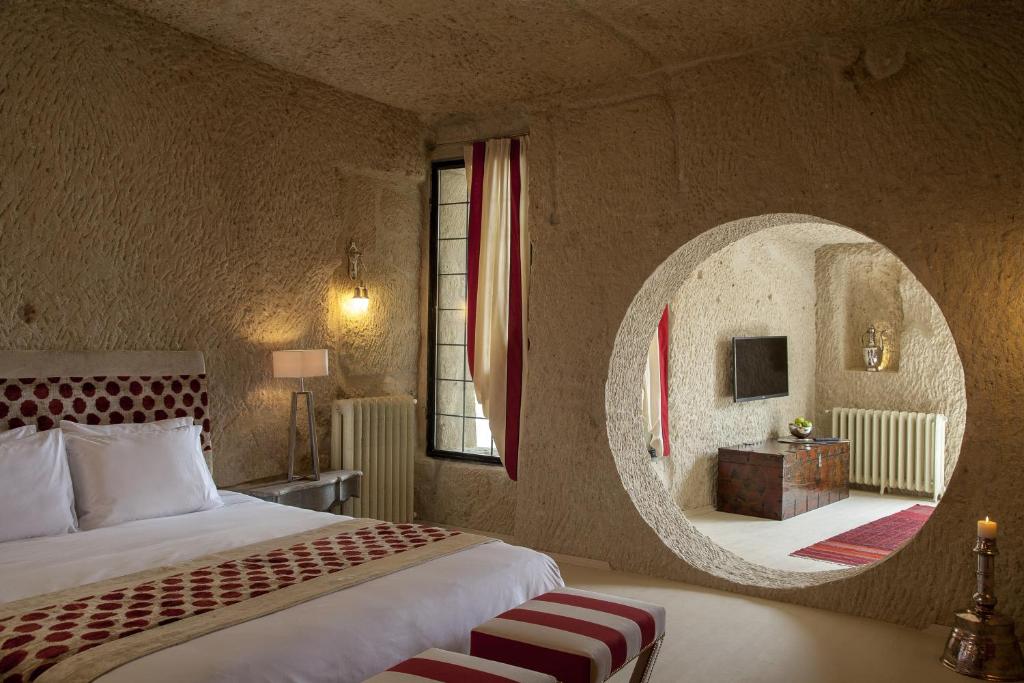 Postel nebo postele na pokoji v ubytování Hezen Cave Hotel