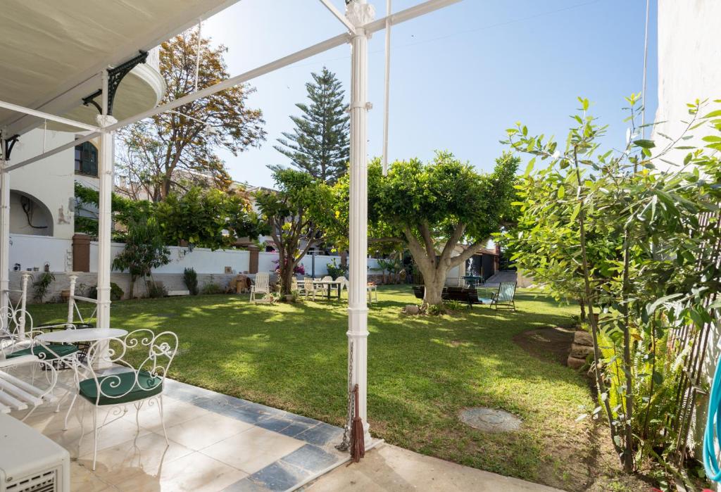 A garden outside Villa Amalia Suites Malaga