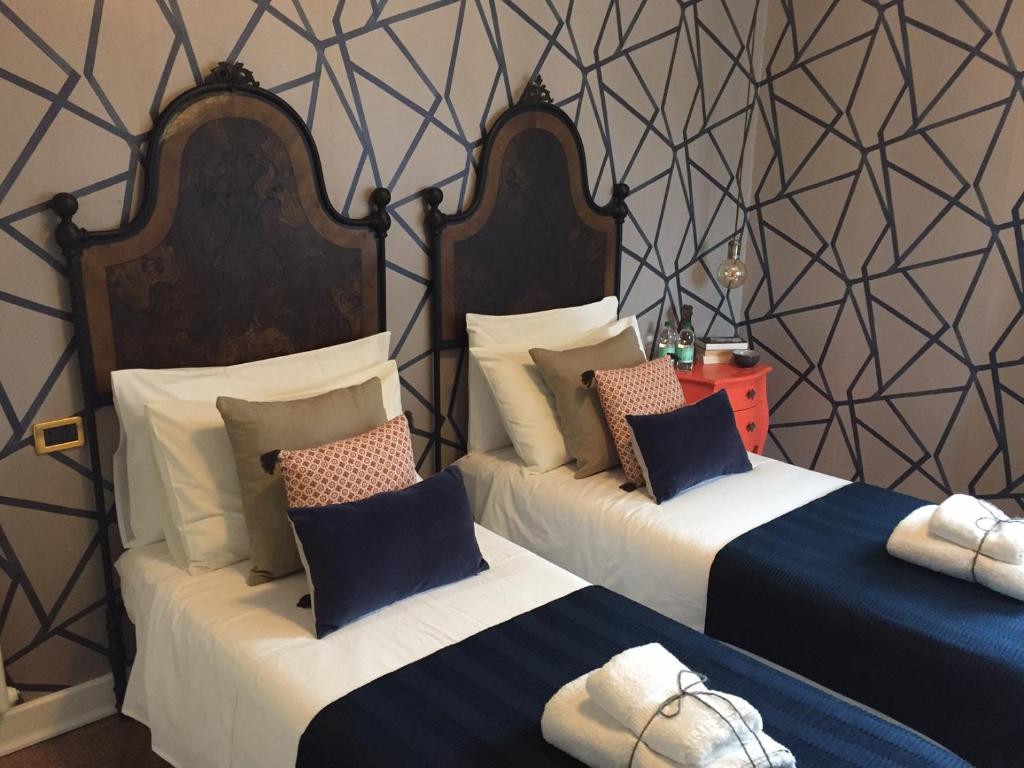 Postel nebo postele na pokoji v ubytování B&B Colombo by Addler House Ospitality