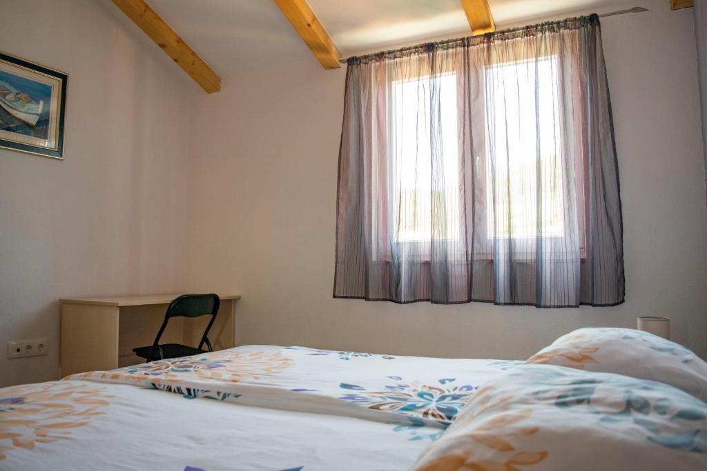 Postel nebo postele na pokoji v ubytování Apartments Linda