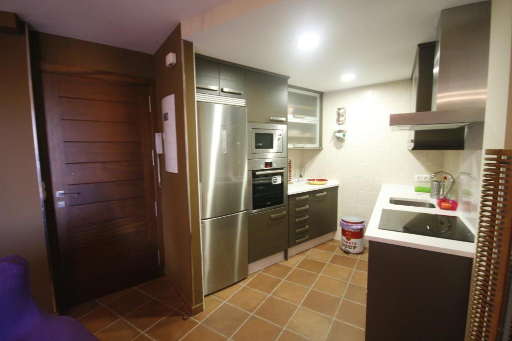 Kuchyň nebo kuchyňský kout v ubytování Apartamentos Casas Colgadas