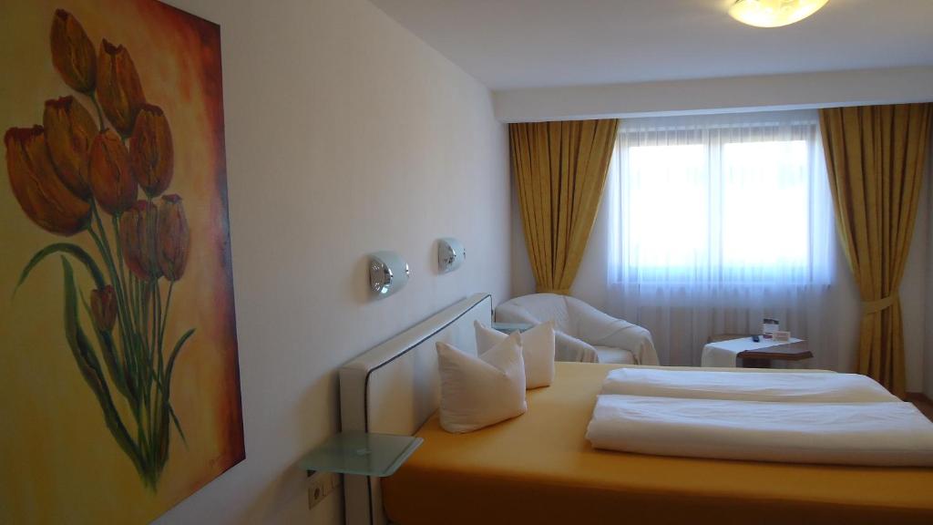 Posteľ alebo postele v izbe v ubytovaní Landhaus Klausnerhof Hotel Garni