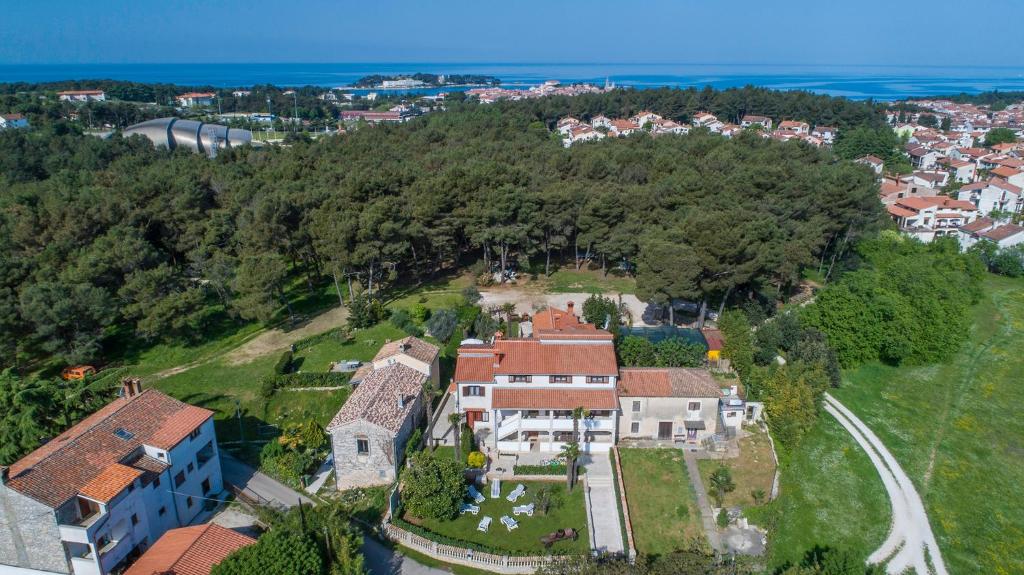 an aerial view of a large house on a hill at Apartments Rita in Poreč