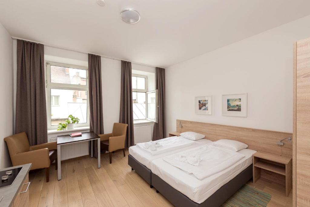 Posteľ alebo postele v izbe v ubytovaní Metro Apartments Vienna