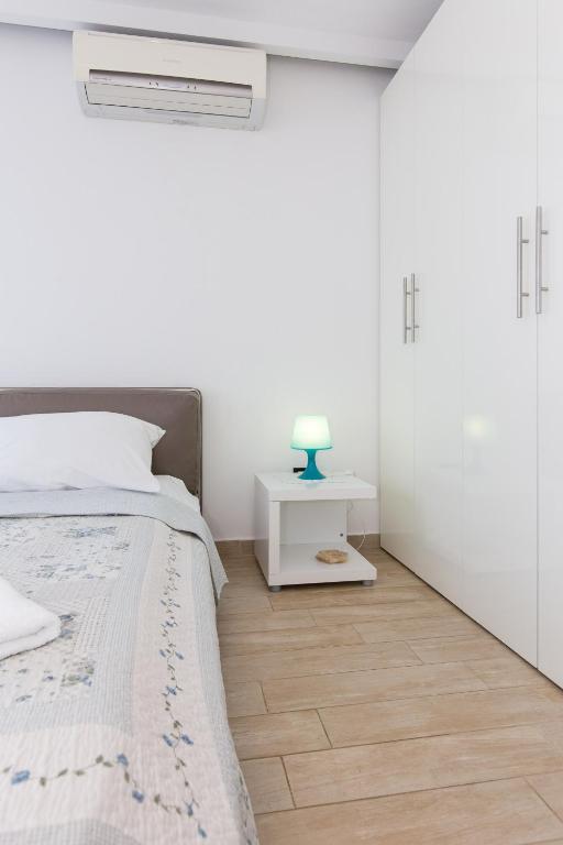 Posteľ alebo postele v izbe v ubytovaní Apartments & rooms DDD2