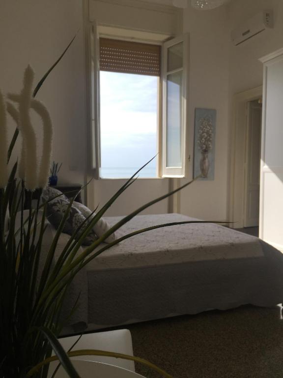 Posteľ alebo postele v izbe v ubytovaní B&B di mare e d'azzurro