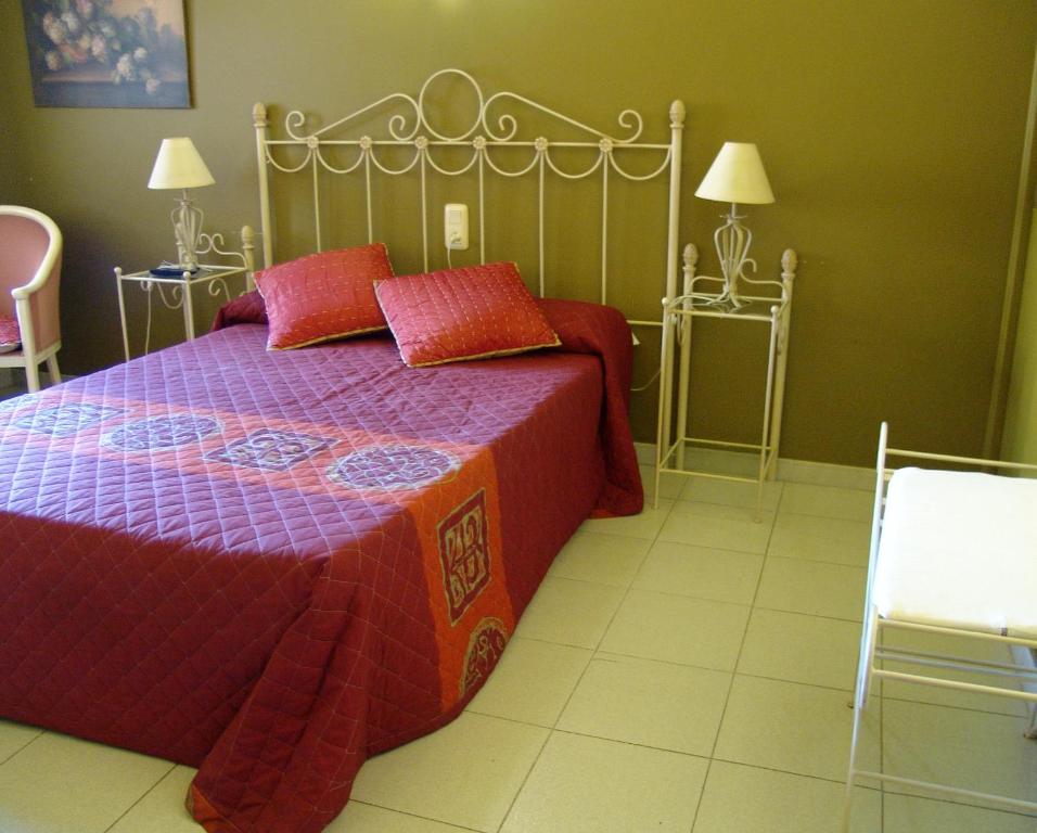 Postel nebo postele na pokoji v ubytování Hotel Pinxo