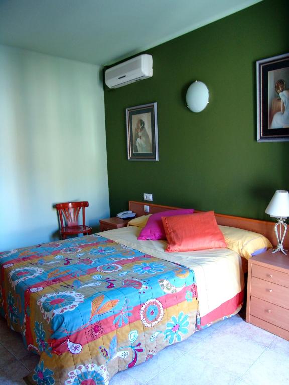 Postel nebo postele na pokoji v ubytování Hotel Pinxo