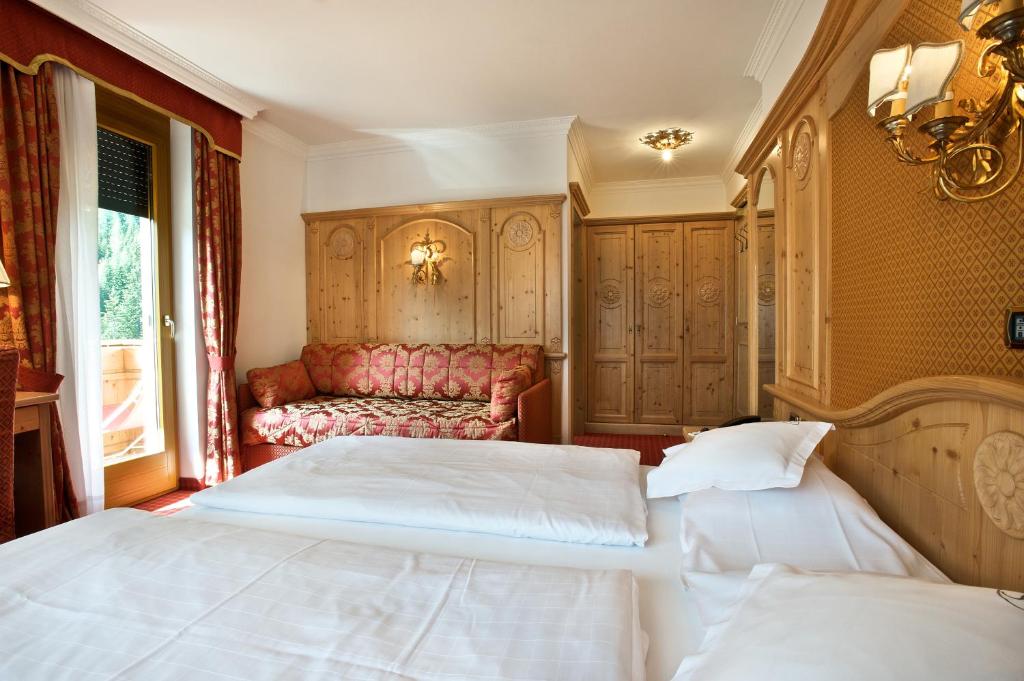 Postel nebo postele na pokoji v ubytování B&B Garni Serena
