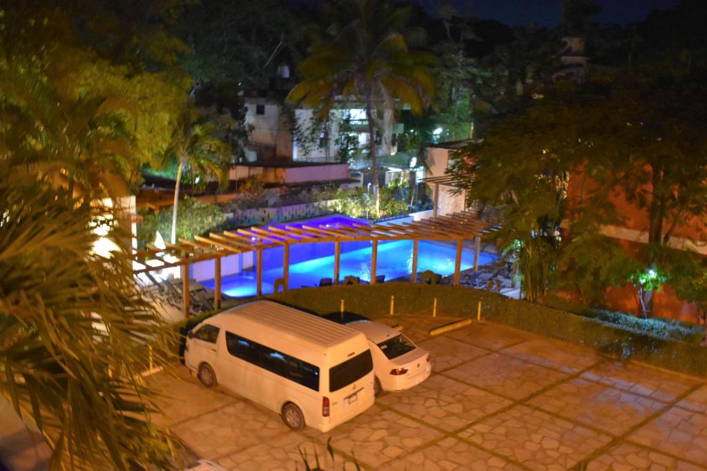 Bazén v ubytování Hotel Maya Tulipanes Palenque nebo v jeho okolí
