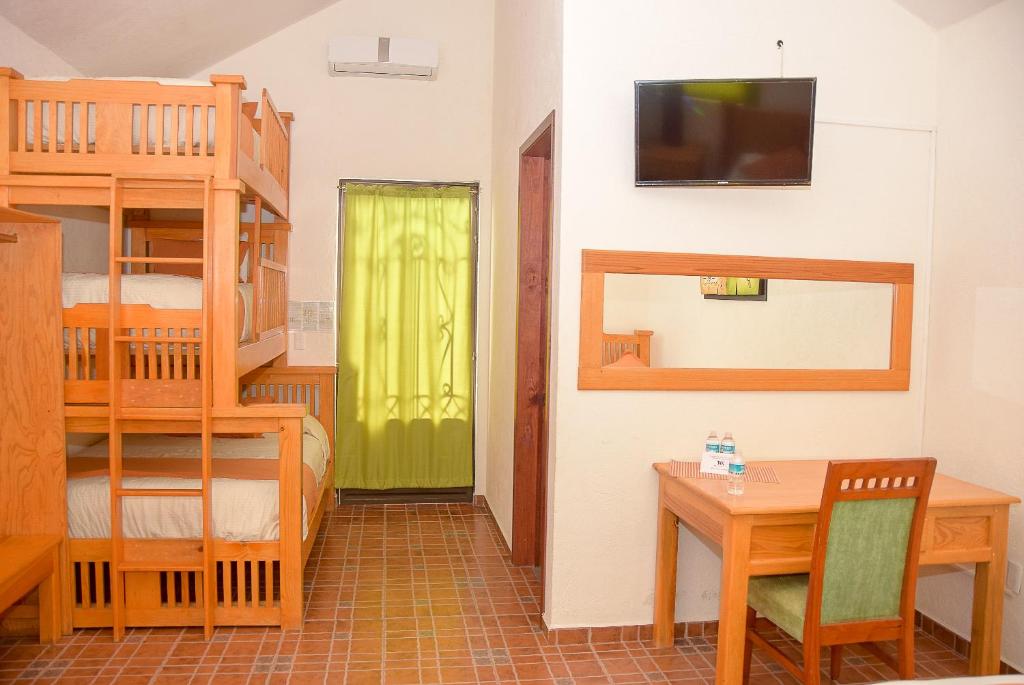Postel nebo postele na pokoji v ubytování Hotel Real de TX
