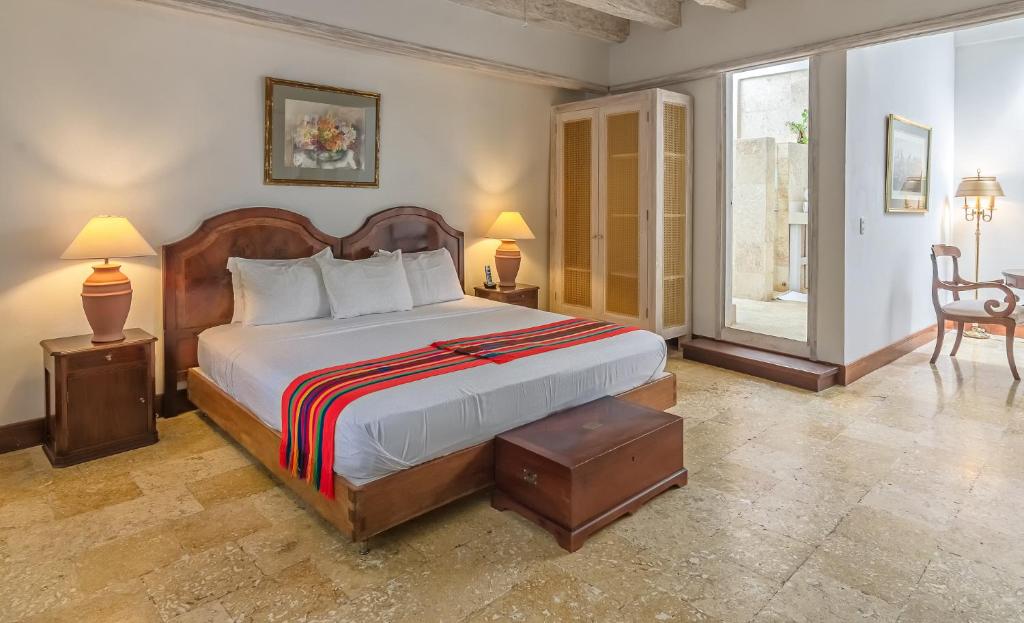 Een bed of bedden in een kamer bij Casa Pizarro Hotel Boutique