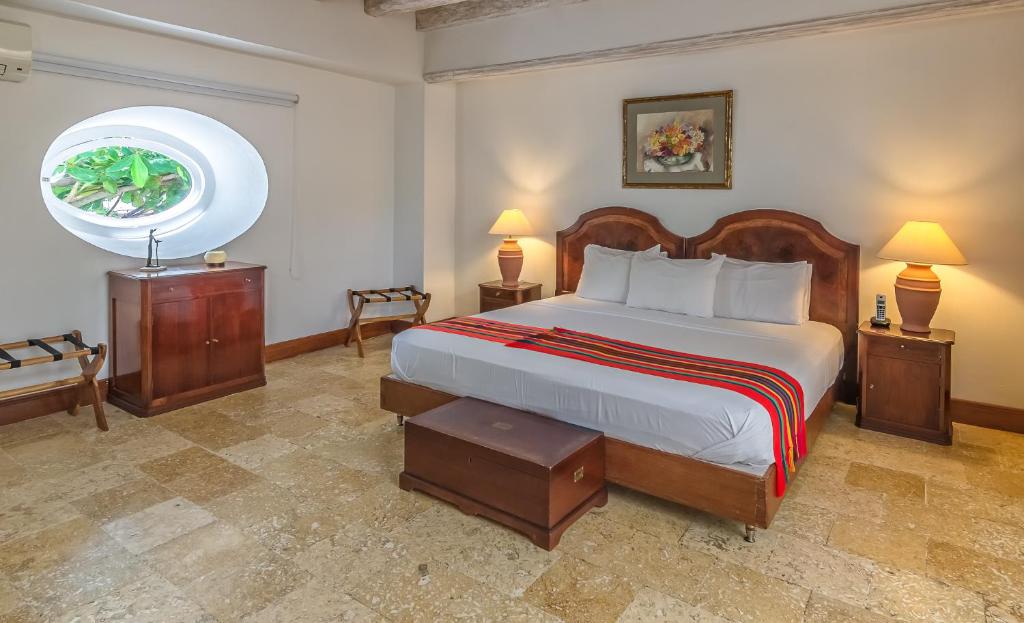 Een bed of bedden in een kamer bij Casa Pizarro Hotel Boutique