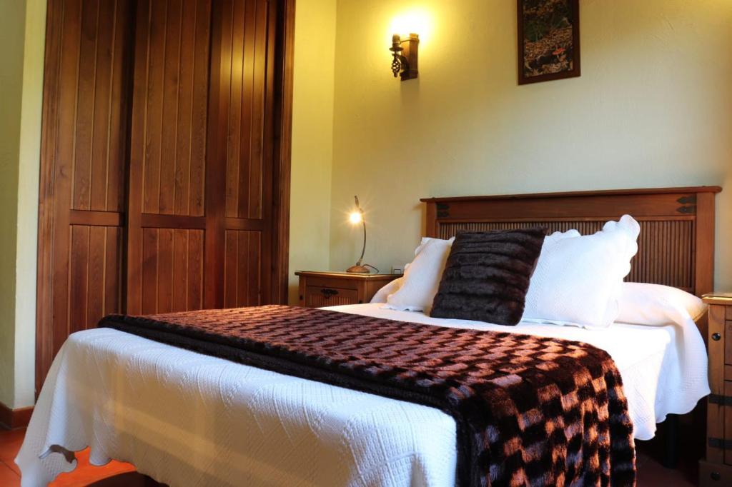 Cama o camas de una habitación en Complejo Rural Las Palomas
