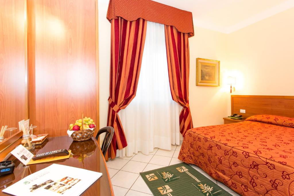 Postel nebo postele na pokoji v ubytování Hotel Ristorante Paladini