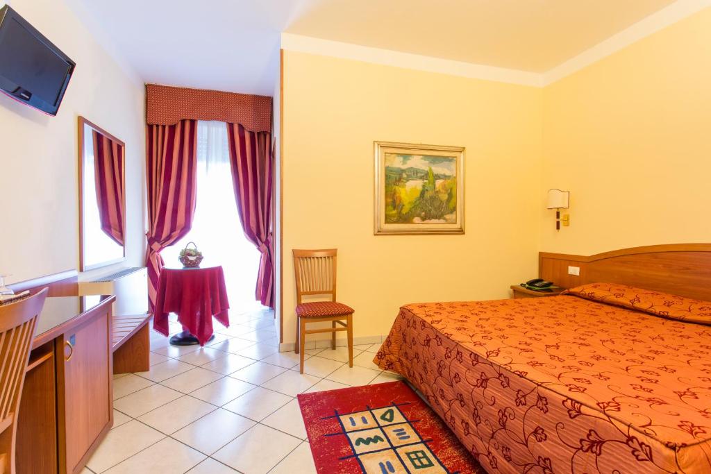 Postel nebo postele na pokoji v ubytování Hotel Ristorante Paladini