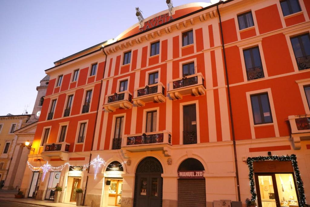 a large orange building in a street at BB SAVOIA Affittacamere in Campobasso