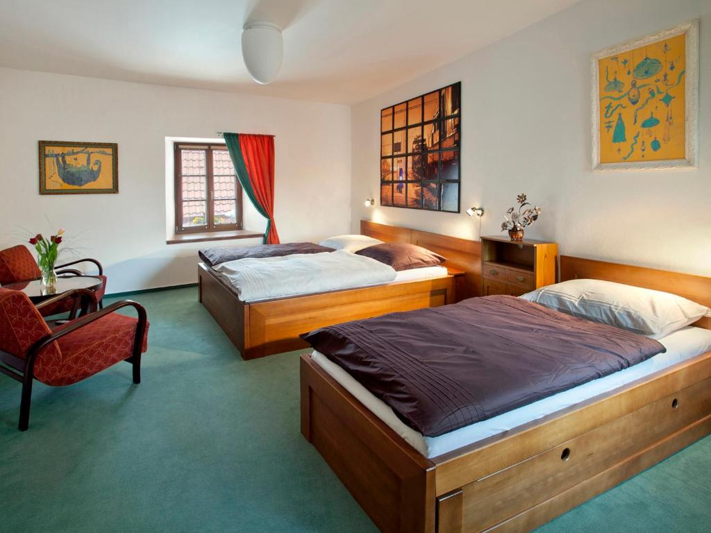 Posteľ alebo postele v izbe v ubytovaní Staroměstský Penzion