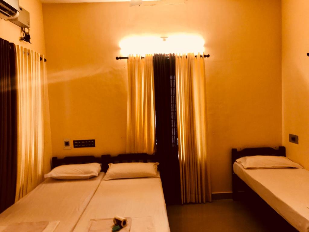 Postel nebo postele na pokoji v ubytování Bastian Homestay