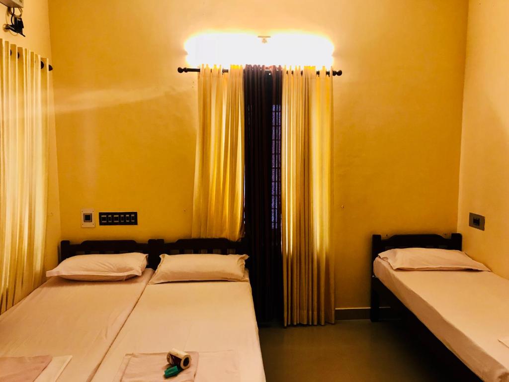 Postel nebo postele na pokoji v ubytování Bastian Homestay