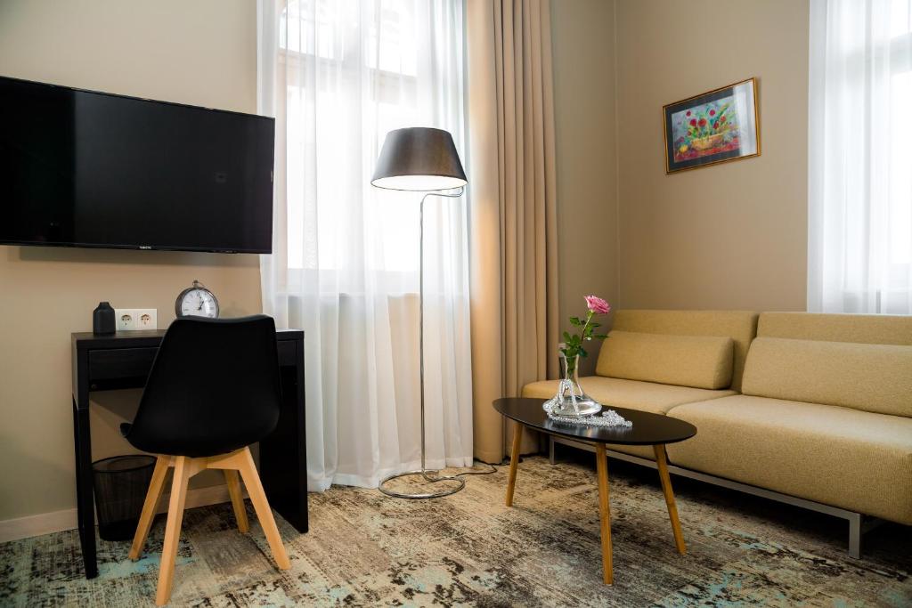 TV a/nebo společenská místnost v ubytování Boutique Apart Hotel Adagio