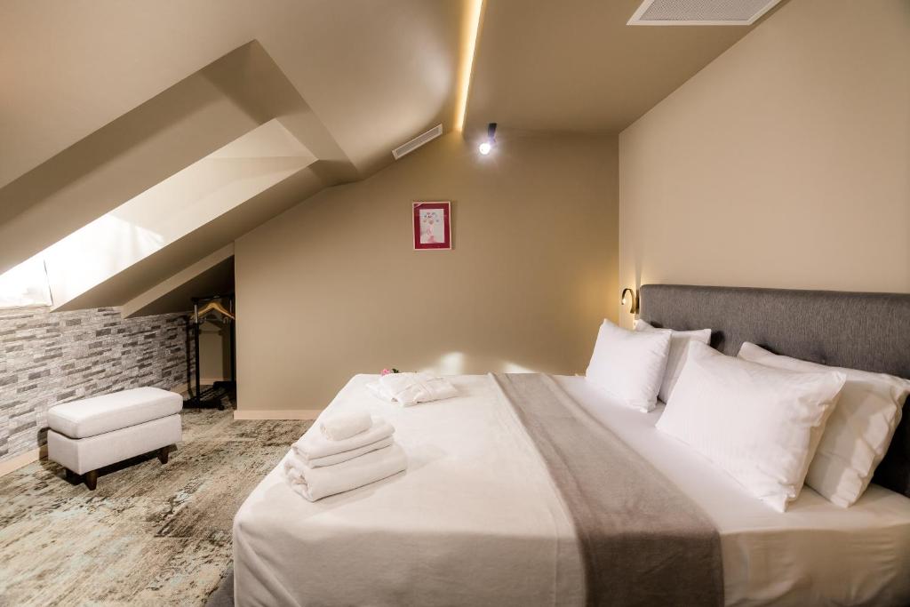 Postel nebo postele na pokoji v ubytování Boutique Apart Hotel Adagio