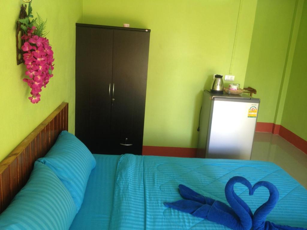 Postel nebo postele na pokoji v ubytování Lanta Blue House