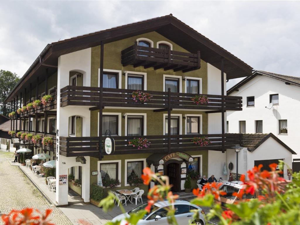 a large building with balconies on the side of it at Hotel Bräukeller in Lam