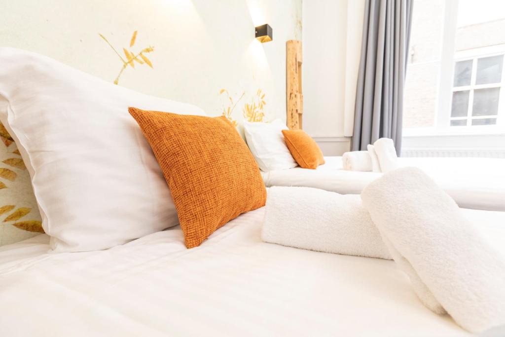 Postel nebo postele na pokoji v ubytování Hotel Pagi
