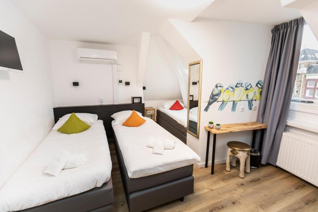 Postel nebo postele na pokoji v ubytování Hotel Pagi