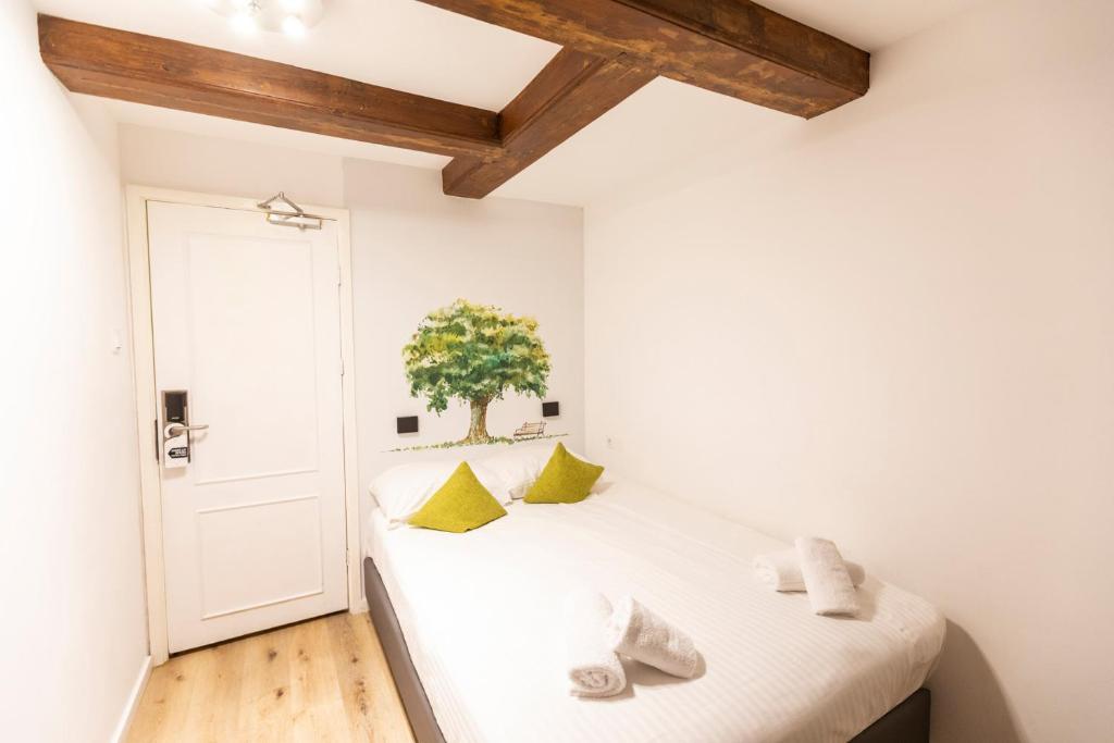 Postel nebo postele na pokoji v ubytování Hotel Pagi