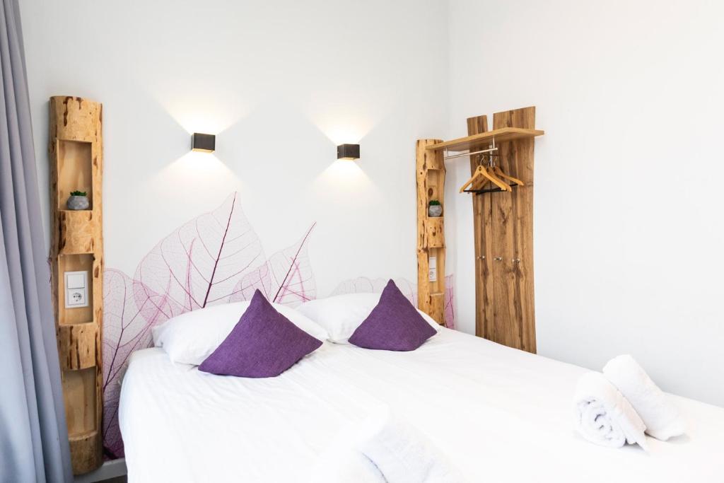 Postel nebo postele na pokoji v ubytování Hotel Pagi