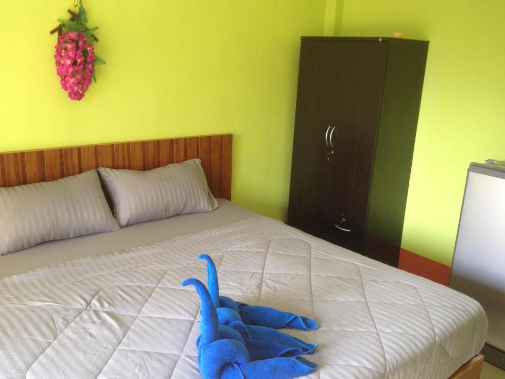 Postel nebo postele na pokoji v ubytování Lanta Blue House