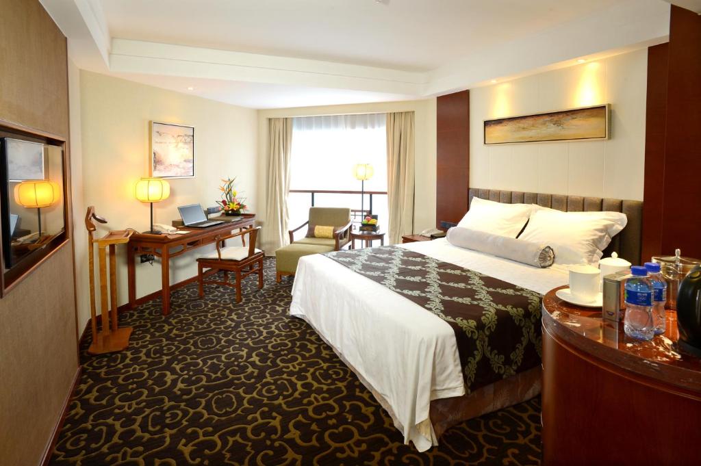 Postel nebo postele na pokoji v ubytování Xiyuan Hotel