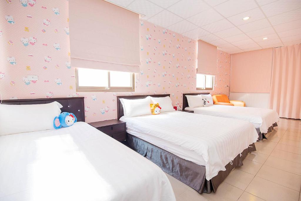 Postel nebo postele na pokoji v ubytování Happiness B&B