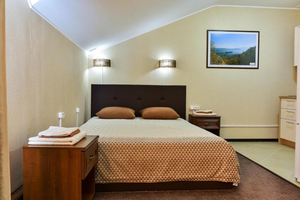 Кровать или кровати в номере Hotel Volga