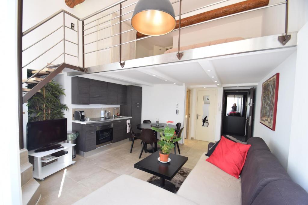 a living room with a couch and a table at Perla Duplex - No Better Location In Nice in Nice