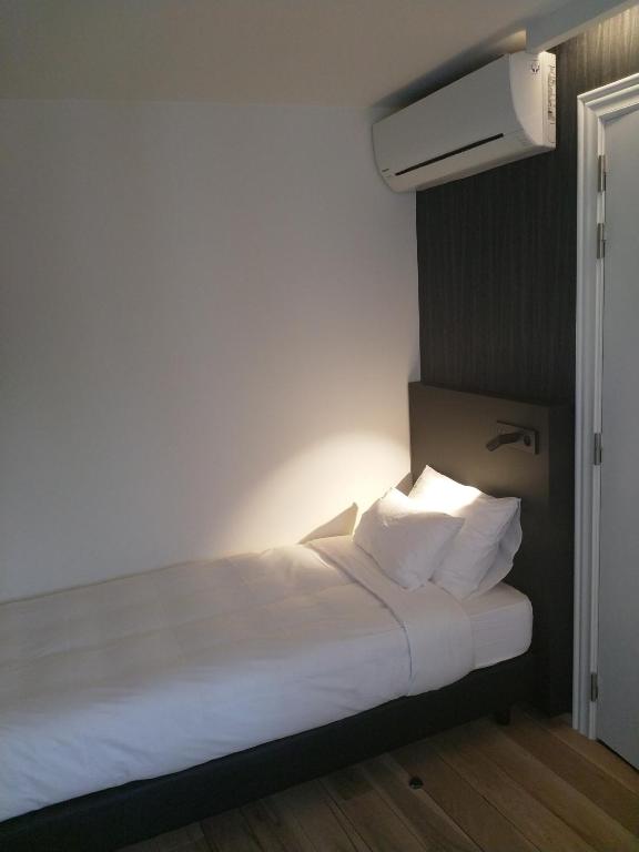 Postel nebo postele na pokoji v ubytování Hotel Kronacker
