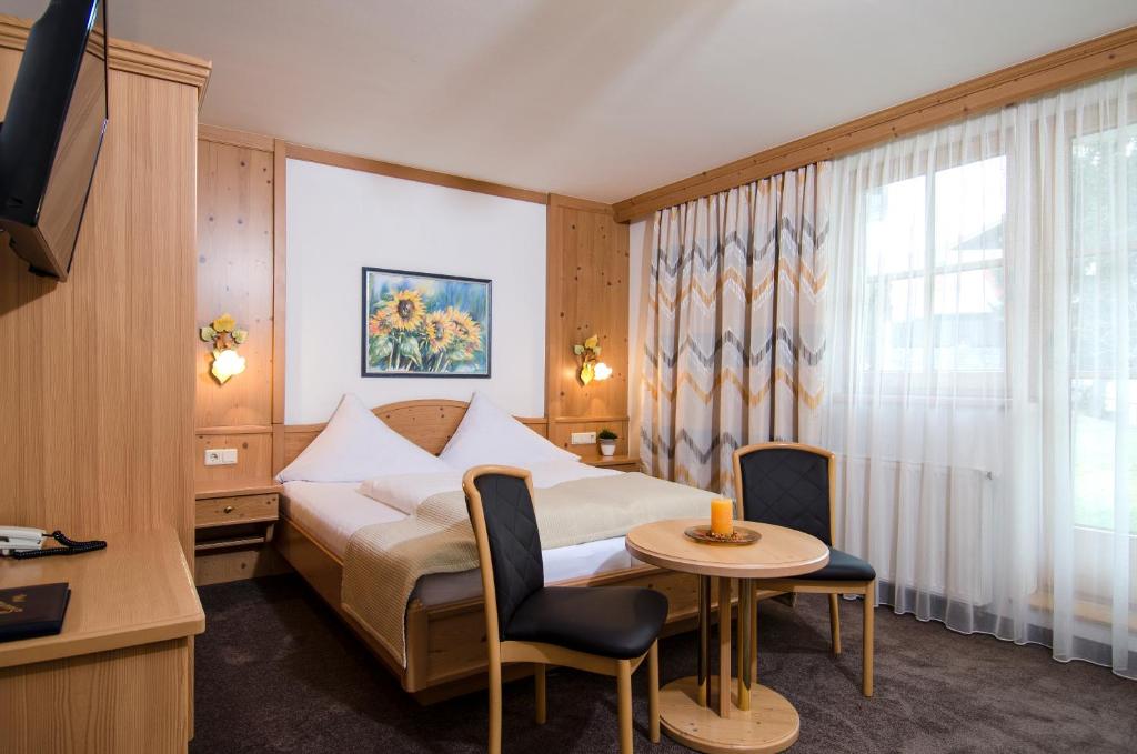 Posteľ alebo postele v izbe v ubytovaní Hotel Garni Subretta