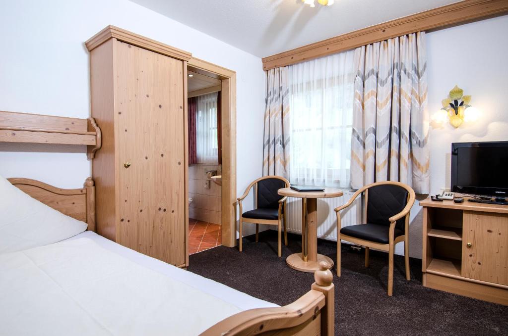 Posteľ alebo postele v izbe v ubytovaní Hotel Garni Subretta