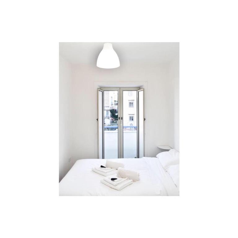 Łóżko lub łóżka w pokoju w obiekcie Secret Room Naples