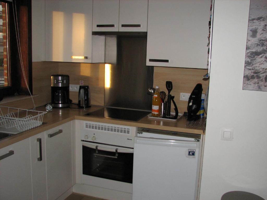 Kuchyň nebo kuchyňský kout v ubytování Residentie Beverly
