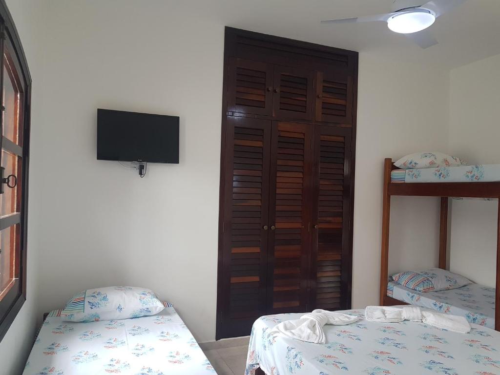  MANSÃO FRENTE A PRAIA - Locação de suítes com área de lazer compartilhada