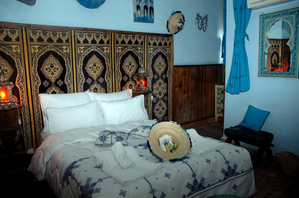 Postel nebo postele na pokoji v ubytování Riad Lahboul