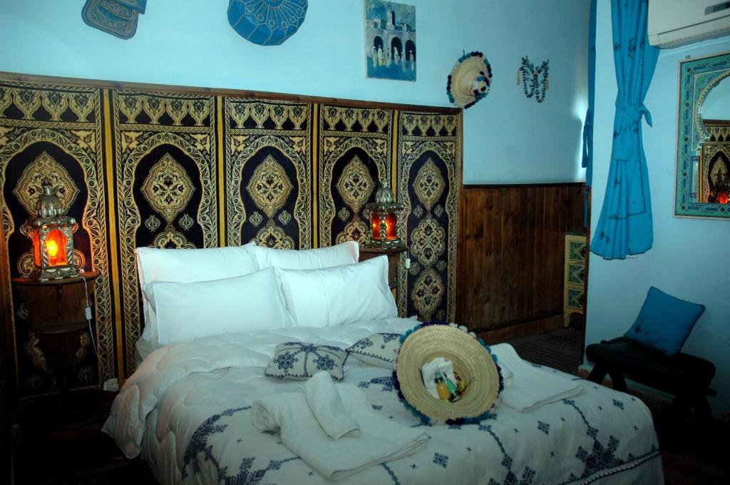 Postel nebo postele na pokoji v ubytování Riad Lahboul