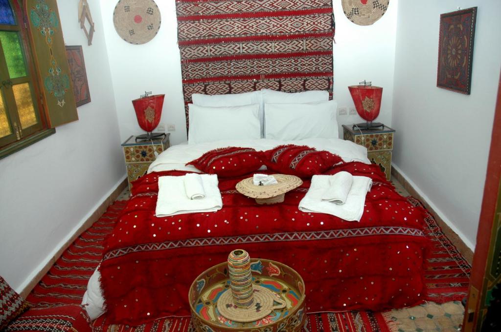 Postel nebo postele na pokoji v ubytování Riad Lahboul