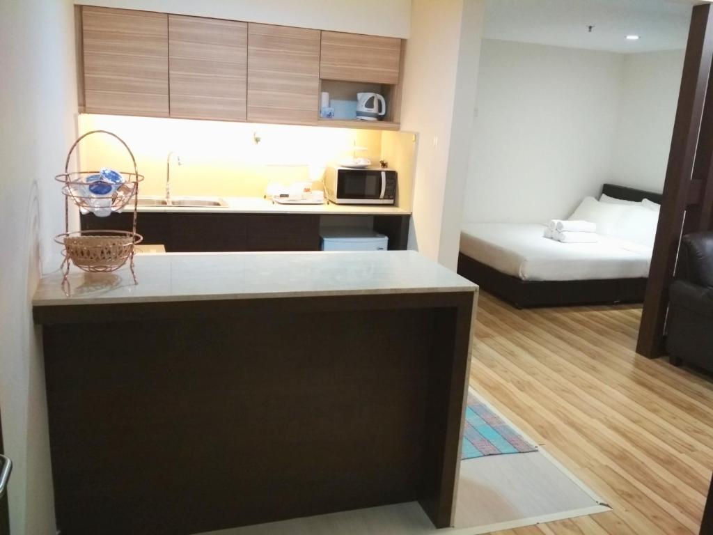 Postel nebo postele na pokoji v ubytování Classy Studio Apartment (KBCP)
